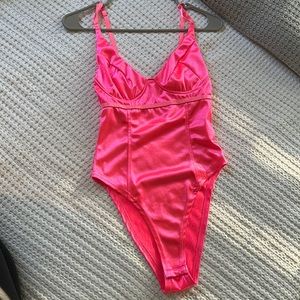 Neon pink body suit